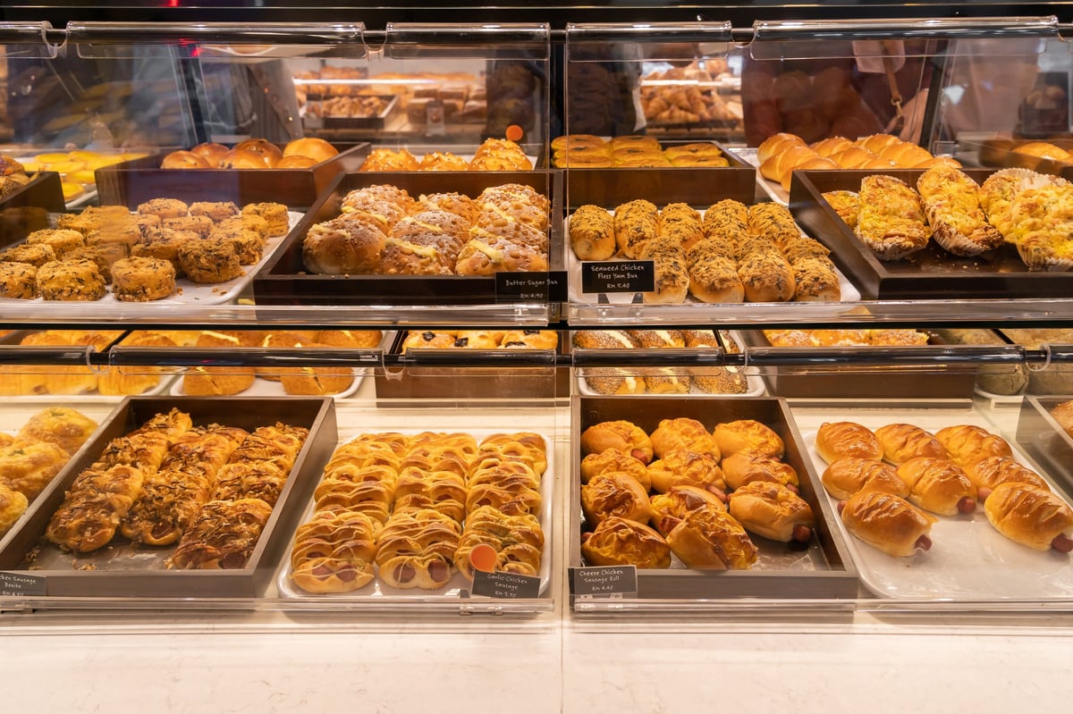 Assorted baked goods arranged on a tray in a bakery
