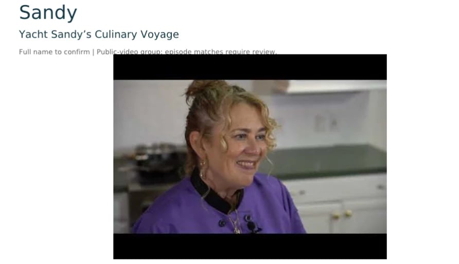 Woman in purple shirt smiling in a kitchen setting from Yacht Sandys Culinary Voyage