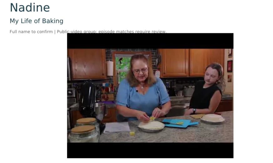 Two women in a kitchen preparing food at a counter, with baking supplies and plates visible