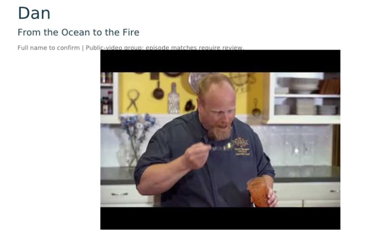 Man in dark chefs uniform preparing food in a bright yellow kitchen
