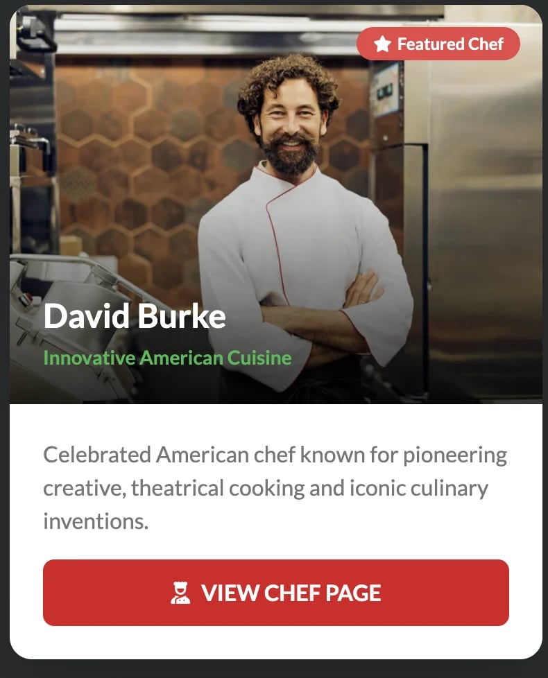Featured chef David Burke wearing a white chefs jacket with arms crossed in a modern kitchen, specializing in innovative American cuisine