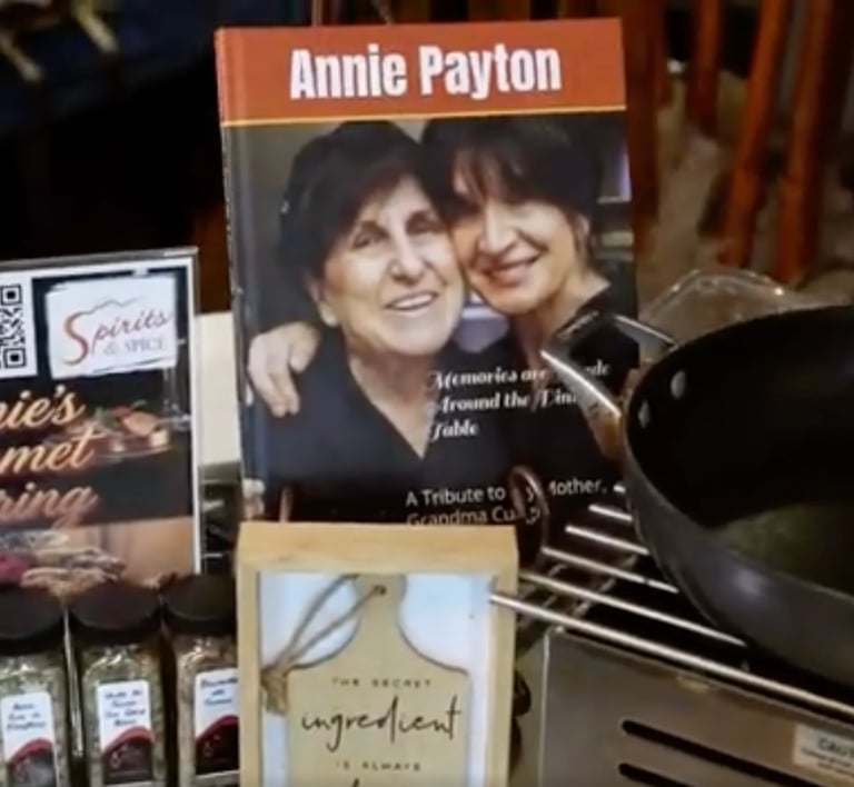 Annie Payton book display with memoir about a mother and daughter, surrounded by other books and kitchen items