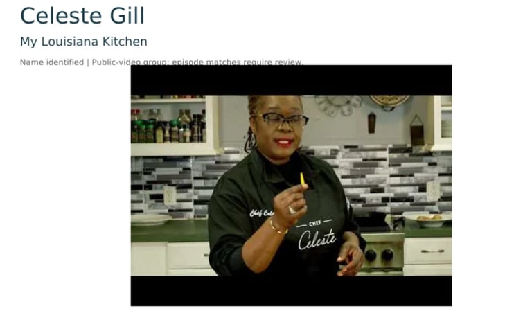 Celeste Gill smiling in her kitchen wearing glasses and a black Celeste branded shirt
